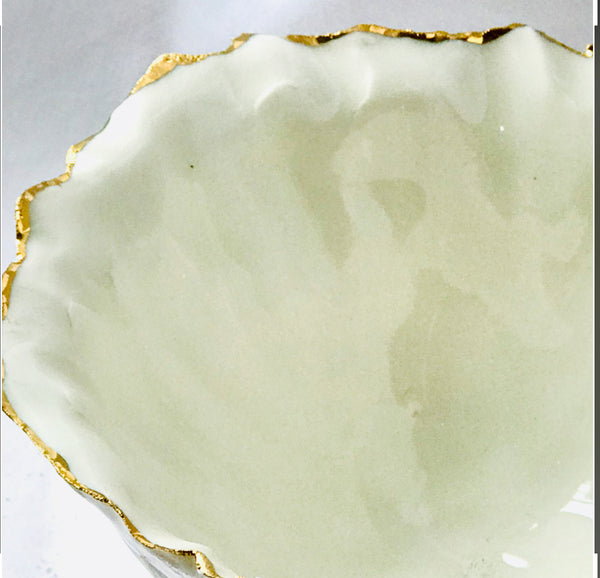 Deep sculpted porcelain and gold bowl