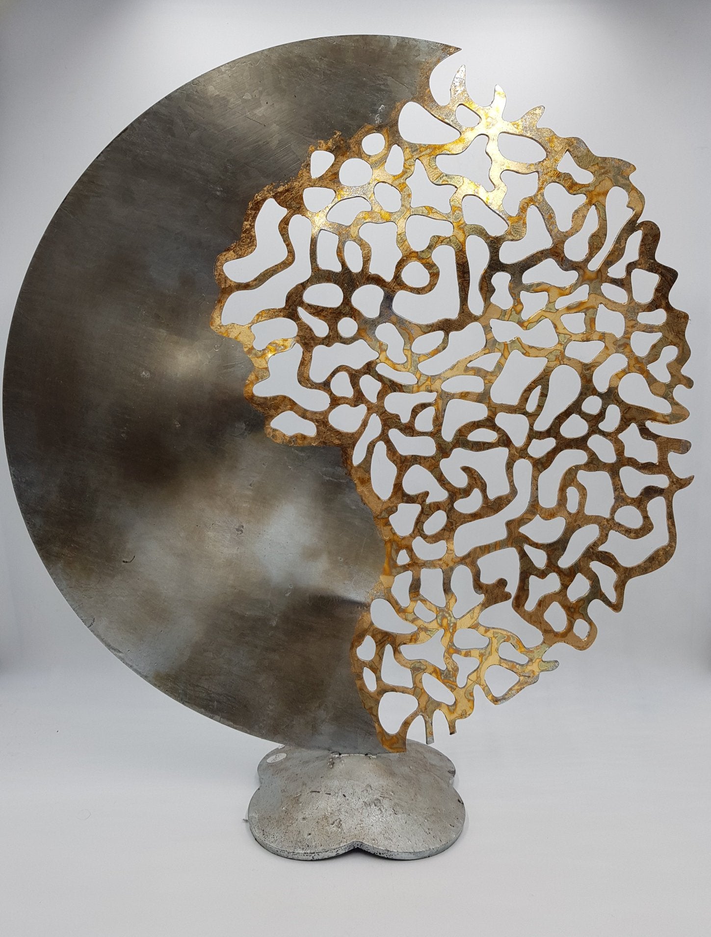 Metal round sculpture by John Sparks