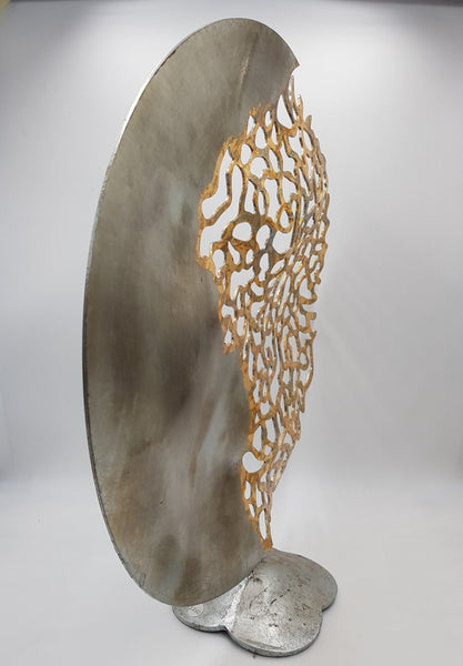 Metal round sculpture by John Sparks