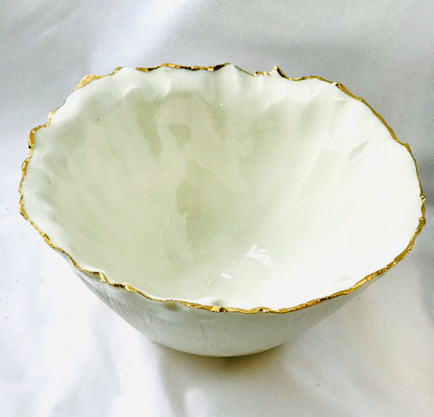 Deep sculpted porcelain and gold bowl